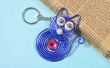 Hoe maak je leuke sleutelhangers met blauwe draad gewikkeld kat hanger