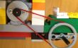 Een LEGO-auto door een Motor van een DVD-speler met gebroken karproces