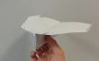 Maken van een glijden papieren vliegtuigje
