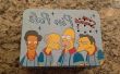 Doos van de lunch dat speelt fragmenten uit "The Simpsons"