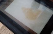Verbrand vet film uit oven glas verwijderen. 