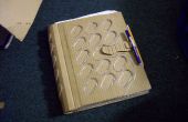 Rebinding-een schetsboek met behulp van verspild karton