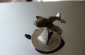 Hoe maak je een miniatuur vliegtuig van een munt