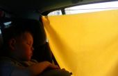 Zon jaloezieën voor het kind in de auto
