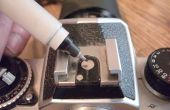 Monteren van een digitale camera op de top van een SLR camera