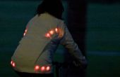 Licht voor het leven: gloeiende knop fietsen jas